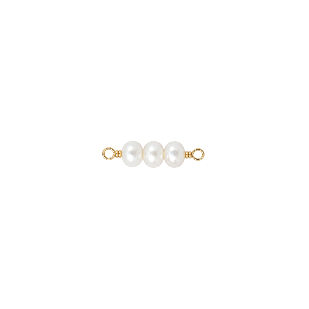 Gold and pearl jewelry piece on a white background