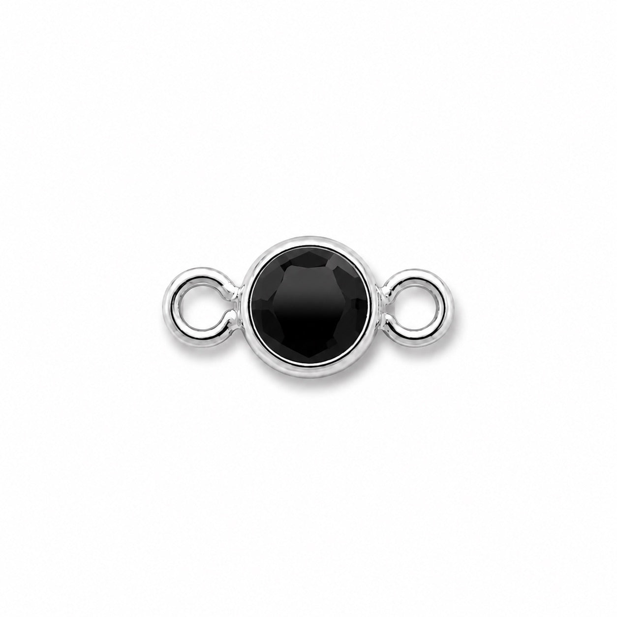 black faceted cut stone in silver bezel setting