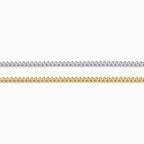 Two gold chains on a white background