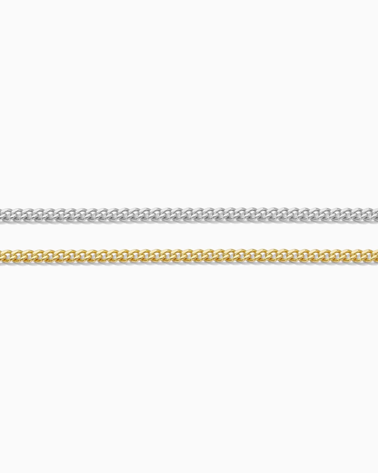 Two gold chains on a white background