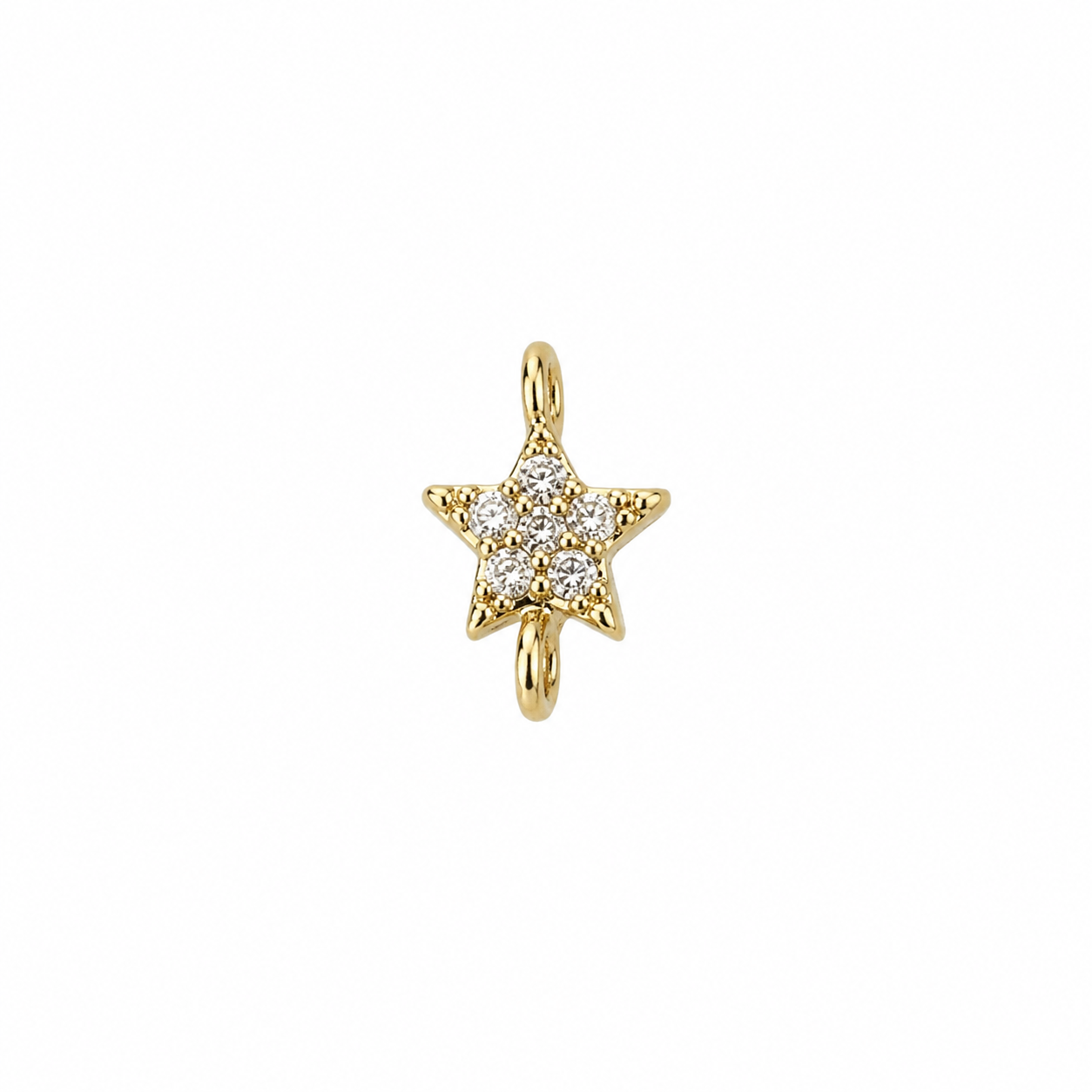 A small gold star-shaped jewelry charm with a cluster of clear stones in the center, shown on a plain white background.