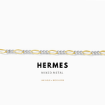 Hermes mixed metal bracelet with gold and silver links on a white background