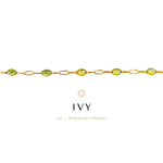 Gold bracelet with green gemstones on a white background, featuring the brand 'IVY'.