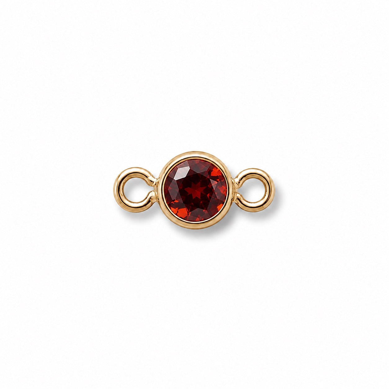 Gold jewelry connector with a January red garnet gemstone on a white background
