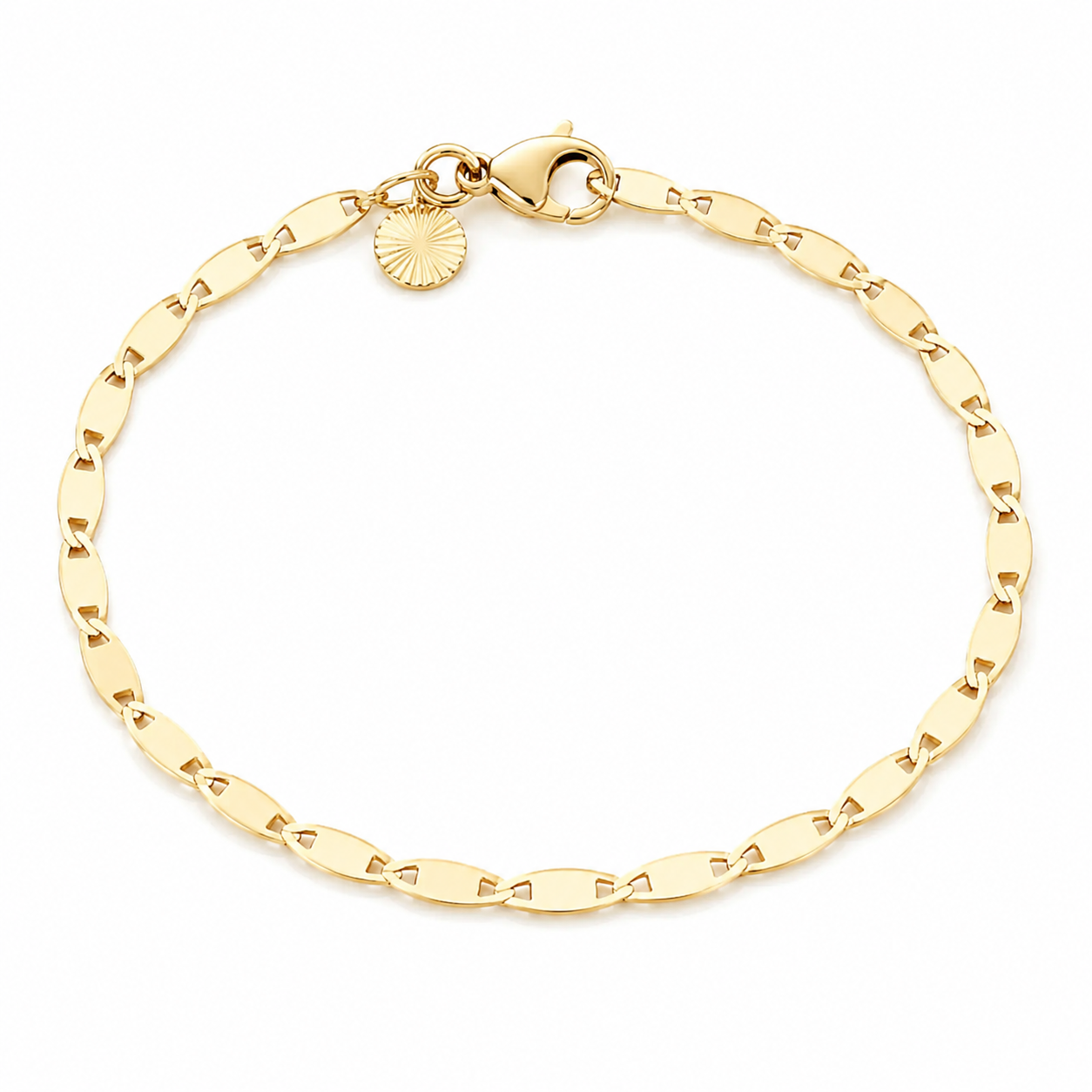 Gold bracelet with a small round charm on a white background