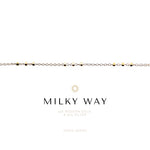 Necklace with gold and silver beads on a white background, featuring the brand 'Milky Way'.