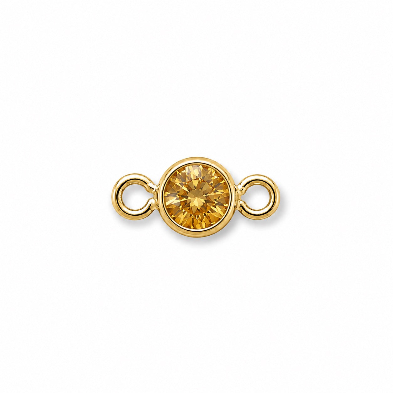 Gold jewelry connector with a round yellow gemstone on a white background