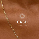 A close-up image of a bracelet with interlocked gold chains against a light background.