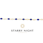 Gold bracelet with blue stones on a white background, featuring the 'Starry Night' brand.